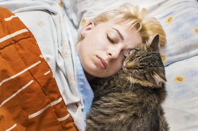 why does your cat like sleeping on your head